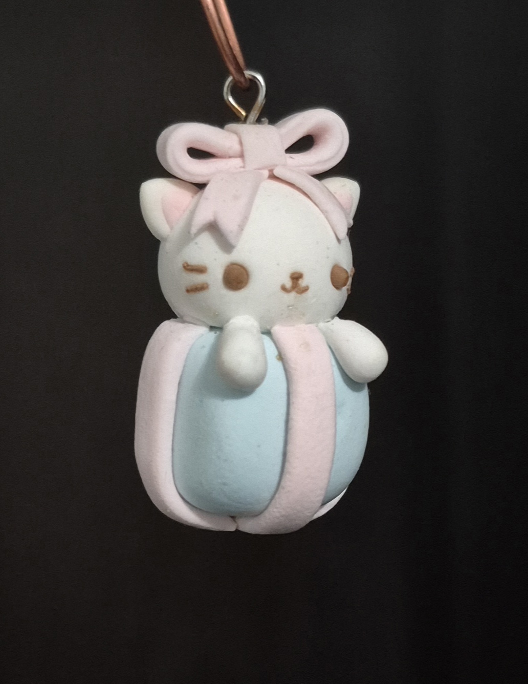 picture of a small clay present charm