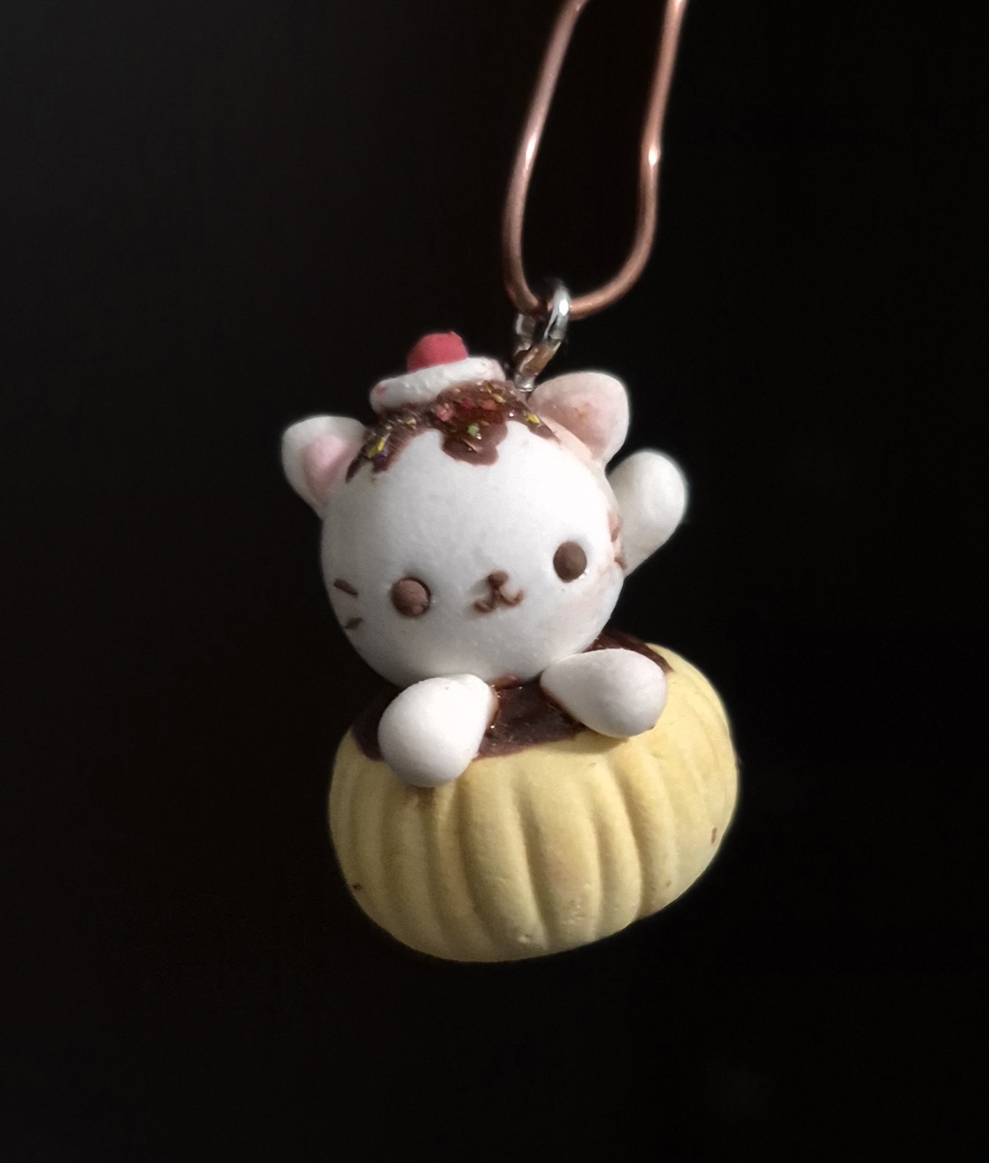 picture of a small clay tart cat charm